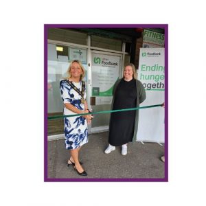 Lisburn Foodbank Ribbon-Cutting: Mayor Amanda Grehan cut a green ribbon outside Lisburn Foodbank with Lynsey Caqeua, CEO; marking the official opening.